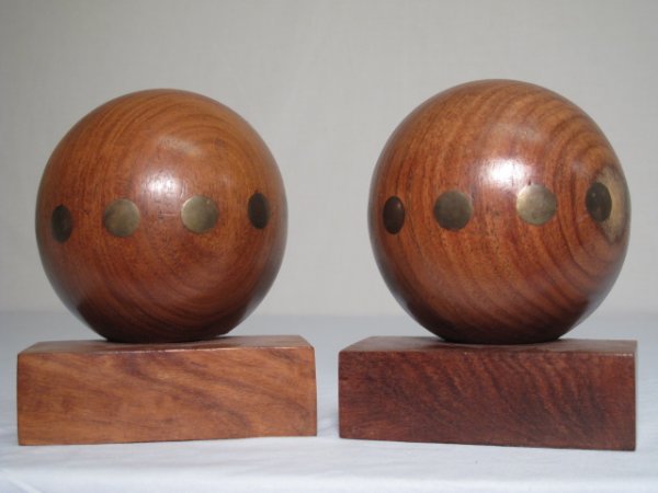 PAIR VINTAGE RAYMOR BRASS AND TEAK BOOKENDS: A pair of classic Raymor mid-century bookends. Teak wood with brass inlay. Each measures 5" x 2 1/4" and 6 1/4" high. Condition good but for minor scuffs and missing attachment to base on one side of