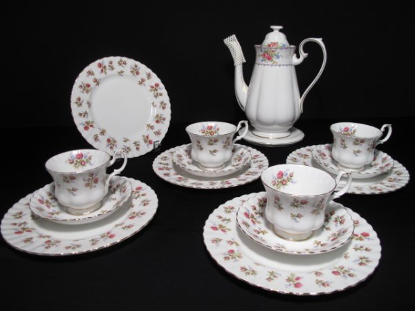 ROYAL ALBERT ENGLISH BONE CHINA 15 pieces: 15 pieces of Royal Albert English bone china including a teapot (no pattern name), a white china trivet, four cups and saucers in the Winton pattern and five - 8 1/4" plates in the Winton pattern. Wei