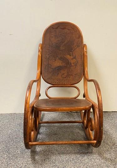 THONET VICTORIAN BENTWOOD DRAGON CHAIR: Thonet Victorian bentwood dragon design rocking chair. Measures a total of 39.75" tall x 21.5" wide and 36" long. The seat is carved with a foliate style crest, and the backrest with a dragon crest. C