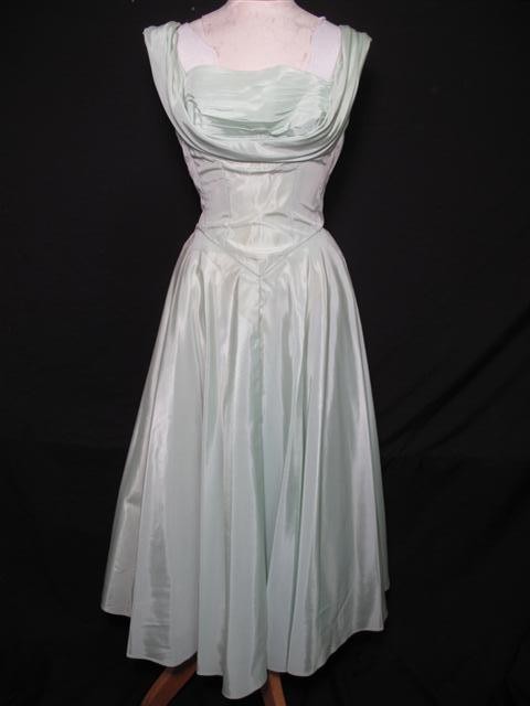 DANCE ORIGINALS BY FRED PERLBERG TAFFETA BALL GOWN: Dance Originals by Fred Perlberg taffeta ball gown. Sewn in horsehair slip. Ballerina length with Tudor bodice, and bow in back. Slight discoloration due to age and stains, but otherwise good conditio