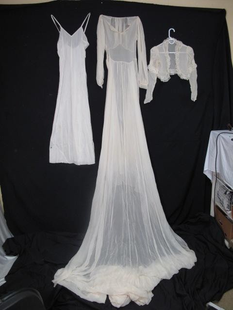 VINTAGE 3 PIECE CHIFFON WEDDING GOWN: Vintage 3 piece chiffon wedding gown. All chiffon gown over separate satin sheath with lace embellished chiffon jacket. Dress is 52 inches long with an eleven foot train. Beautiful, no rips or tears. 