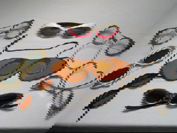 ANTIQUE & VINTAGE EYEGLASSES AND GOGGLES: A collection of antique and vintage eyewear consisting of four pairs sunglasses, three pair driving goggles and one pair leather wrapped aviator style goggles. All in generally worn condition. See ima