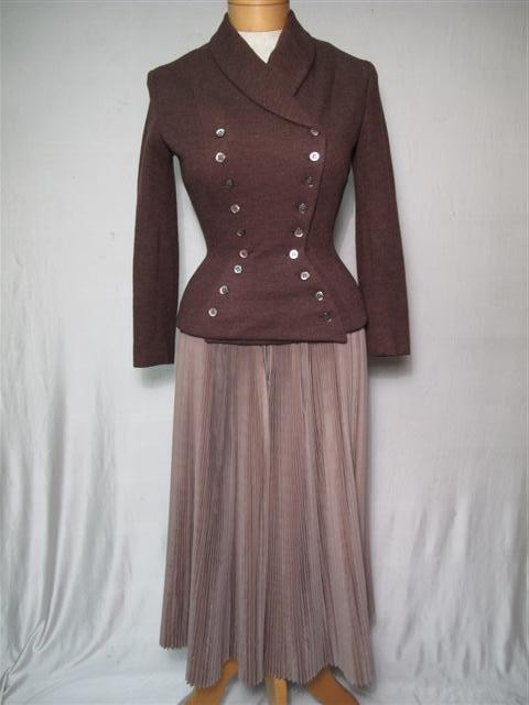 VINTAGE SACONY JACKET PLEATED SKIRT DIOR DESIGN: Vintage Sacony jacket and pleated skirt, Dior Design. 1949 Dior Design. Brown mix fitted double breasted jacket. Mother of pearl buttons. Fully lined. Made by Sacony. Jacket in pretty good condition b