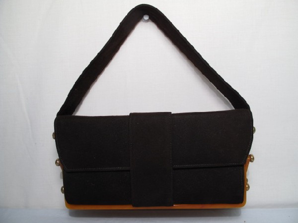 VINTAGE HANDBAG BY TRE-MOR: Vintage handbag by Tre-Mor. Unusual 3 tier design. 3 colors of lining, with Bakelite hinges. Outside of the purse is done in brown suede cloth. Excellent condition. Shipping weight 2 lbs.