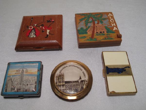 FIVE VINTAGE LADIES COMPACTS EMPIRE STATE SOUVENIR: Five vintage ladies compacts including souvenir compacts of the Empire State building (probably made in the early 1930's), the Statue of Liberty, and Westminster Abbey in London. Largest compact measu