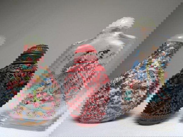 3 SNUFF BOTTLES CINNABAR PORCELAIN PAINTING GLASS: 3 snuff bottles: carved cinnabar, floral porcelain, and reverse painting of couple and children. 2 1/2" to 3 14" high. Weight: .3 lbs. Condition: good