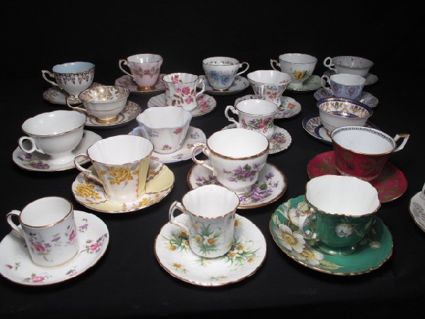 GROUP LOT OF 20 CUPS AND SAUCERS: Group lot of 20 cups and saucers. Includes Shelley, Tuscan, Adderley, Paragon, and more. Largest measures 5.5" wide x 3" tall. Smallest measures 5" wide x 3" tall. Overall good condition, shows signs 
