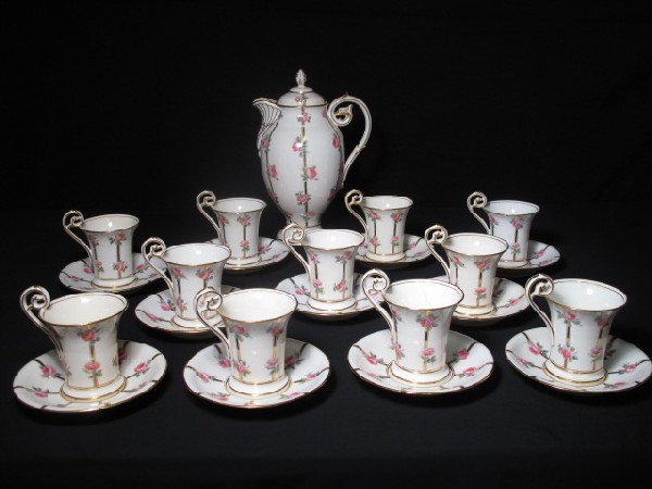 TIFFANY & CO MINTONS TEA SET 23 PIECES: Includes 11 cups (4"x4", 6 have hairline cracks and all have teat stains), 11 saucers (5.5", 7 have hairline cracks), Teapot with lid (11" tall x 7" wide). Large piece missing on the lid, along with a