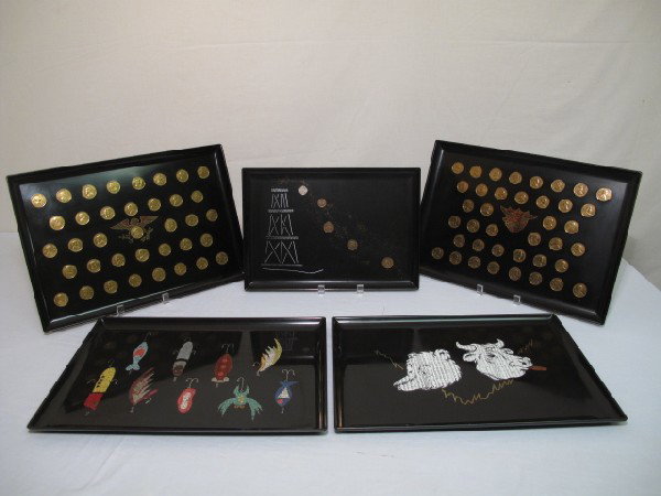 FIVE COUROC TRAYS PRESIDENTIAL FISHING LURES ETC: Five satin black trays by Couroc of Monterey California. Each with inlay of various materials including coins, wood, faux stone and white metal. Two with Presidential design and coins, one with fishin