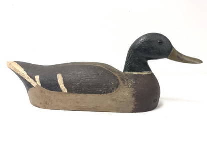 VINTAGE HAND MADE DUCK DECOY: Vintage hand made duck decoy measuring 17.5" long x 6.5" tall x 5.75" wide. Unsigned. Condition: broken peg sticking out of the side, appears to have repair at neck, see images. Weight: 2.3 lbs.