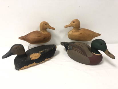 FOUR VINTAGE CARVED WOOD DUCK DECOYS: Lot of four vintage carved wood duck decoys. Includes one Stoney point decoy measuring 14.25" long x 6.5" tall. Includes two by J.R. Farmer, and one unsigned. Condition: wear and losses to unsigned