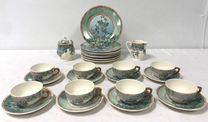 GIEN FRANCE PORCELAIN DINNERWARE: "LE LIERRE": Gien France porcelain dinnerware for eight. "Le Lierre" pattern. Includes 8 of each: 8.75" plates, 5.8" saucers, 3.6" diameter cups. Also includes 5" covered sugar, and 3.75" tall creamer. Each piece