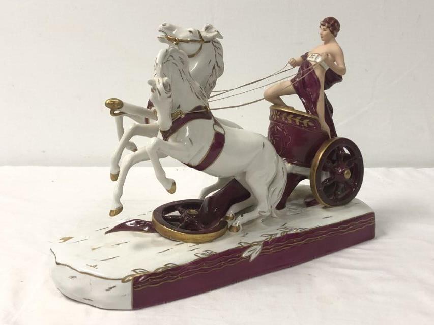 ROYAL DUX PORCELAIN CHARIOT, 1970-1992, L 16.5": H 11", L 16.5", 2 horse chariot with Roman charioteer, hand painted Royal Dux mark in green used from 1970-1992 on underside, underside also bearing the Royal Dux pink triangular D mark, incised numbe