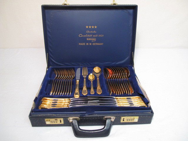 GERMAN GOLD PLATED FLATWARE 70 PCS - BESTECKE SBS S: Bestecke SBS Solingen 23k gold plated cutlery flatware set. 70 pieces total. "Wien" pattern. Each piece marked"23k gold plated Chromstahl". Includes (12) 7.8" dinner forks, (12) 8.75" butter knives, (