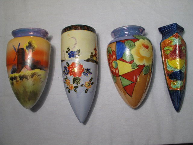 FOUR HAND PAINTED VINTAGE WALL POCKETS: Group lot assorted hand painted wall pockets in the style of Noritake and Nippon. Three ceramic and one pottery. All in good condition, see images for details. Largest measures 8.5" x 3.5", and the sm