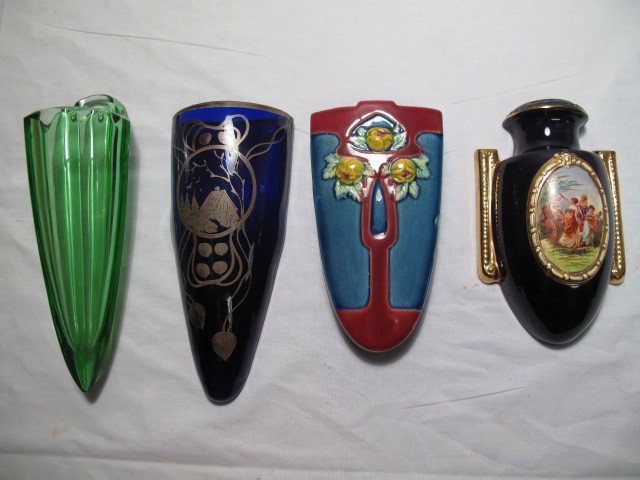 VINTAGE GLASS AND POTTERY WALL POCKETS 4 PCS: Group lot assorted glass and pottery wall pockets. Two art pottery and two glass. Includes cobalt glass with silver wash overlay made in Czechoslovakia, cobalt and gilt hand painted pottery made in Cz