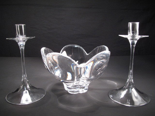 ORREFORS CRYSTAL CANDLE STICKS & BOWL: A crystal bowl by Orrefors. H. 5" W. 8". Also two crystal candlesticks. Each candlestick measures 7.5" tall. Shipping weight 4.7 lbs.