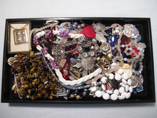 LADIES COSTUME JEWELRY CORO TRIFARI ETC: Lot of assorted ladies costume jewelry. Brands such as Trifari, etc. Necklaces, bracelets, pins, and more. Gold toned, silver toned, beads, rose quartz, enamel, faux pearls, faux gems, etc. Good condi