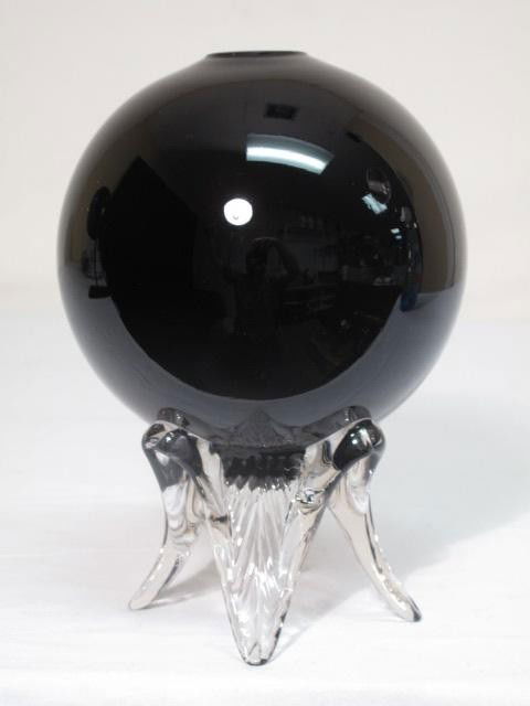 BLACK ITALIAN ART GLASS VASE: Art glass footed orb vase. Black round glass vase with applied clear glass legs. No apparent makers marks. Small scratch at rim. Good condition. Measures 8.5" tall x 6" wide.