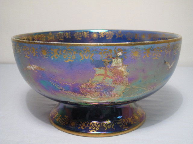 CROWN DEVON LUSTRINE LUSTERWARE BOWL STOKE ON TREN: Crown Devon Lustrine lusterware bowl. Purple lusterware bowl with gilt decoration and rim. Painted at the bottom of the bowl, as well as on the sides to depict ships. Marked on bottom " Devon Lustrine
