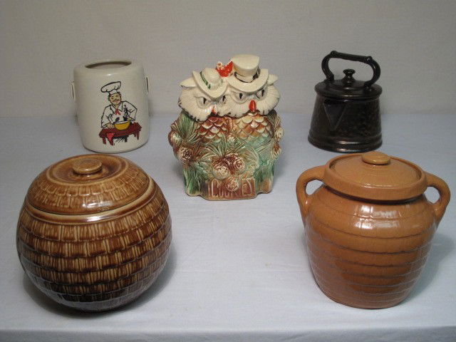MCCOY AND OTHER COOKIE JARS: Group lot assorted McCoy and other cookie jars. Includes Mr. and Mrs. Owl cookie jar (with lid), tea kettle cookie jar (with lid), chef cookie jar (no lid), and two brown cookie jars resembling basket