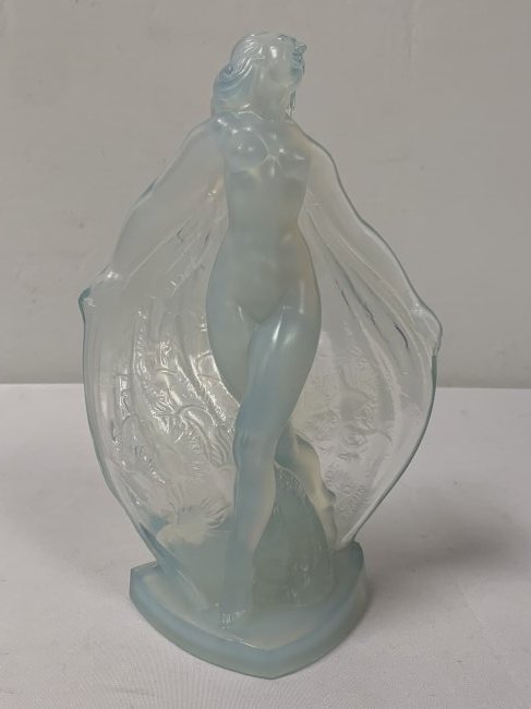 ISADORA SABINO GLASS FIGURE OF NUDE FEMALE: ISADORA SABINO GLASS FIGURE OF NUDE. Female with flowing scarves. Raised signature "Sabino, France". H: 9 1/2", W 6 1/4". Weight: 3.0 lbs. Condition: good.