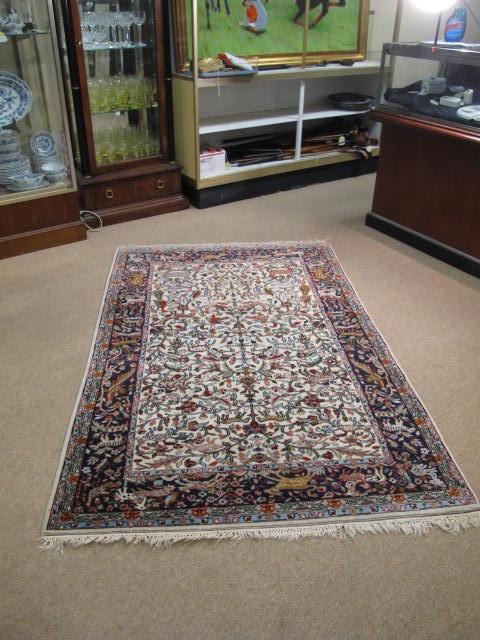 HAND WOVEN WOOL CARPET WITH ANIMAL DESIGN: INDIA