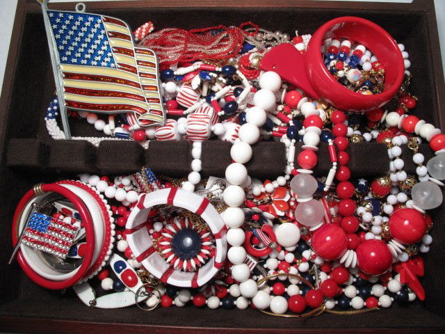 TRAY LOT ASSORTED PATRIOTIC COSTUME JEWELRY TRIFAR: Tray lot of assorted patriotic costume jewelry. Includes brands such as Trifari, Avon and many more. Red, white, and blue colors. Beads, enamel, faux gems, faux pearls, and more. Good condition, see i