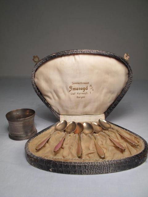 STERLING SILVER DEMITASSE SPOONS & NAPKIN RING: Sterling silver demitasse spoon set & napkin ring. Includes 6 sterling & pink enamel "Smaragd" demitasse spoons, and a sterling napkin ring. Demitasse spoons are in a faux alligator skin case. Spoons