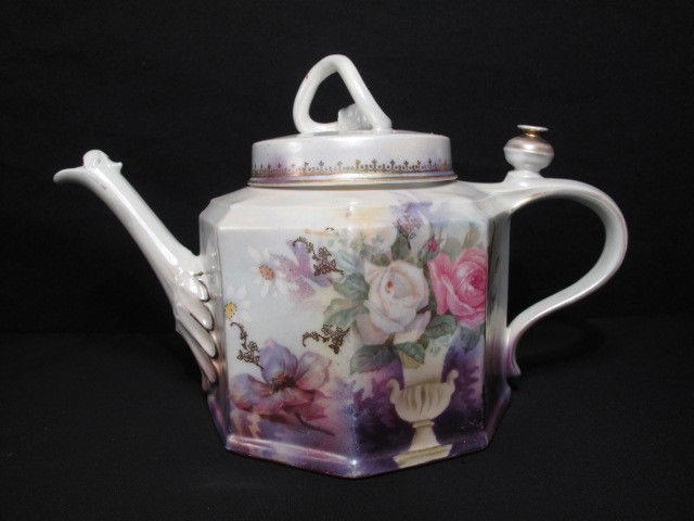 RS PRUSSIA PORCELAIN FLORAL PAINTED TEAPOT: RS Prussia floral porcelain painted teapot. Decorative floral rose painting and gilt. Colors such as purple, pink, green, yellow and more. Marked "RS Prussia" with logo on bottom. Good condition but f