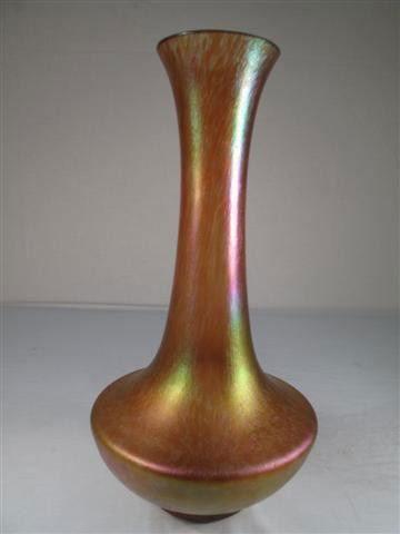 LOETZ ART GLASS VASE GOLDEN PINK IRIDESCENCE: Loetz vase with pale orange body, rose and green iridescence, subtle twisted ribbing. Unsigned. Measures 13" tall. Condition good. Shipping weight 1.9 lbs.