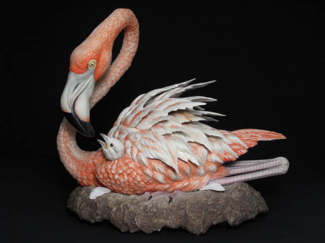 BOEHM BISQUE FIGURE OF A FLAMINGO & BABY, SIGNED: Boehm Bisque figure of a Flamingo and young, signed by Helen Boehm. Measures 15" long by 13 1/2" tall. Condition: possible trim to white one edge of white feathers on base (however this detail is ofte