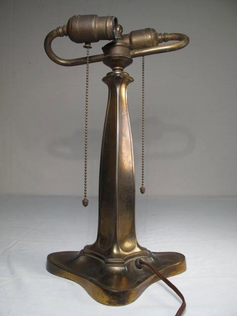 SIGNED PAIRPOINT BRONZE TONE LAMP BASE: Signed Pairpoint double arm lamp base with a bronze tone finish. Measures 15" to top of finial. Condition: Wear to finish. See images. Shipping weight 5 lbs.