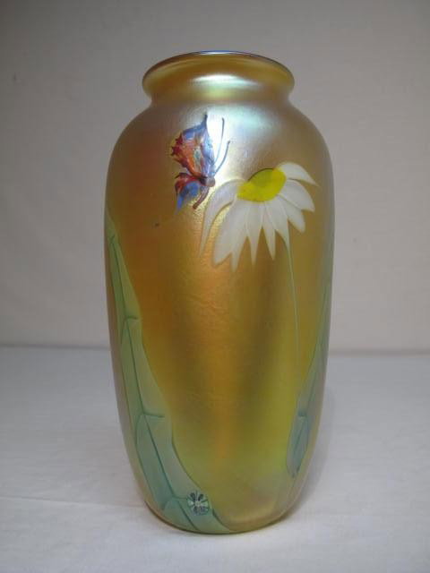B. SILLARS FOR ORIENT & FLUME ART GLASS VASE: Large Orient & Flume paperweight vase with floral and butterfly design, gold finish with pink and silver iridescence, floral and butterfly design and a small millifiore circle at base. Signed, "B. Sil