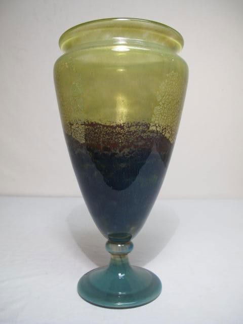 RARE DAUM NANCY ART GLASS VASE: Circa 1925 Daum Nancy art glass vase. Transparent glass in graduated colors of olive/gold, burgundy and blue with geometric panels and gold flecks. Measures 13" tall. Engraved Daum Nancy with the cros