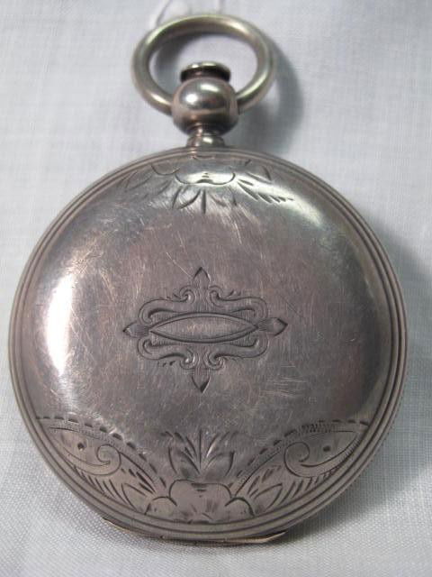 A GENTLEMANS POCKET WATCH: AMERICAN WATCH CO ELLERY: Size 18, Roman numeral dial, American Watch Co, William Ellery, Boston Mass. 15 jewel key wind movement #1864??, in a sterling silver hunter case with replaced plastic crystal. Condition: winds easily