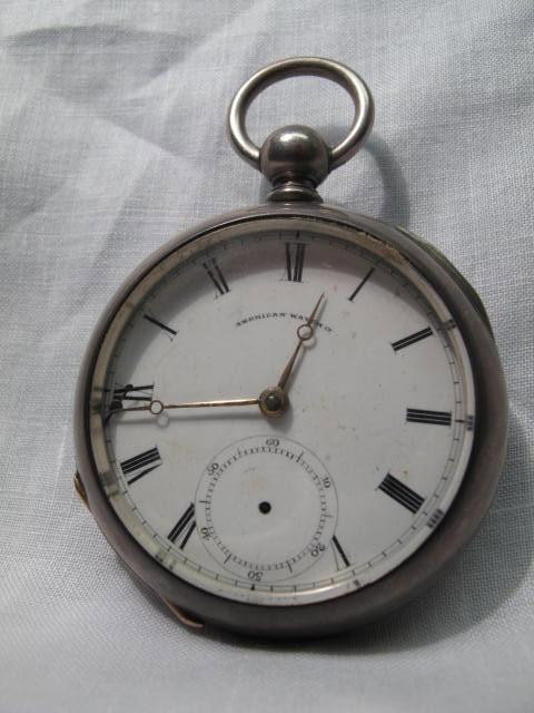 A GENTLEMANS POCKET WATCH: KEY WIND COIN ELLERY: Size 18 key wind pocket watch with American Watch Co. Roman numeral dial, Wm Ellery mechanism #210879 in a Leader coin silver hunter case. Condition: winds easily, running. (We do not guarantee the co