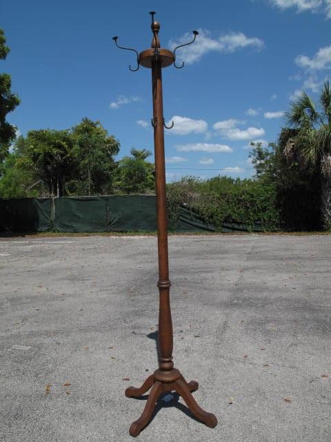 ANTIQUE WOOD & BRASS HALL TREE STYLE COAT HANGER: Wood & brass hall tree style coat hanger. Four footed, four branches at top. Hat hangers as well. Condition: one hat rack hook is missing, tarnishing, wear to coat hanger, see images. Measures 70.5" t