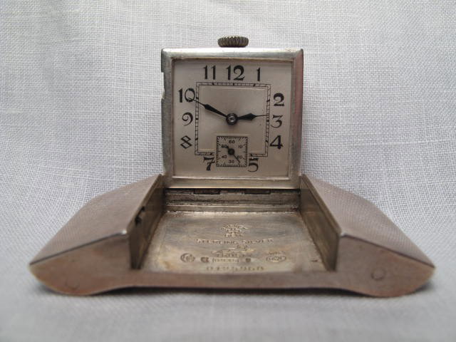 STERLING SILVER BELT BUCKLE SWISS WATCH: Swiss made Sterling silver novelty belt buckle pocket watch. Arabic numeral dial, Swiss made movement #541078, 15 jewels in a Brevet Dem. sterling silver case. Case marked "Brevet Dem Trusty Swiss", a