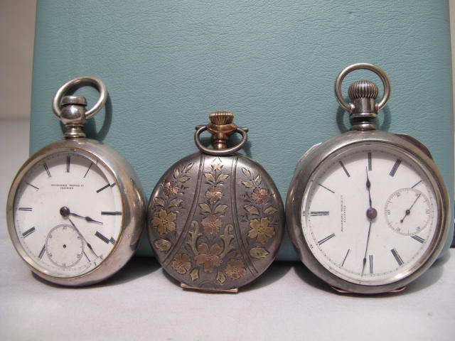 THREE GENTLEMANS POCKET WATCHES: ROCKFORD SILVER: Includes one size 16 (Arabic) and two size 18 pocket watches (roman numeral dials) with Rockford and Huntington movements #s 705962, 5335, and 82713 ( see images. ) Fahys coin silver case, Philadelphi