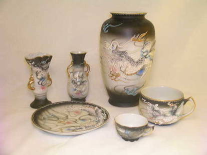 HAND PAINTED PORCELAIN MORIAGE DRAGON MOTIF: HAND PAINTED PORCELAIN MORIAGE DRAGON MOTIF - Made in Japan. Approx 6 pieces. 1 Betsons Vase 7 1/2" high by 4 1/2" wide. 2 Miniature vases not a pair & no markings 4" high by 2" wide. 1 Cup 2