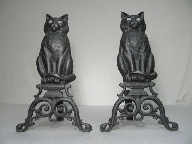 PAIR BLACK CAST IRON FIGURAL CAT ANDIRONS: Pair of black cast iron figural andirons. Each depicts a black cat. Two piece connected with nut & bolt. Condition: good, see images. Each andiron measures 16.5" tall x 7" deep. Shipping weight 19 lbs