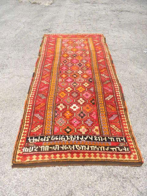 ARMENIAN WOOL PILE RUNNER 8'10" x 3'10": Armenian wool pile runner. Measures 8'10" x 3'10". "Garden" design from Republic of Georgia. c 1940. Colors of white, red, orange, pink, etc. Condition: good, minor wear and fraying to ends. See image