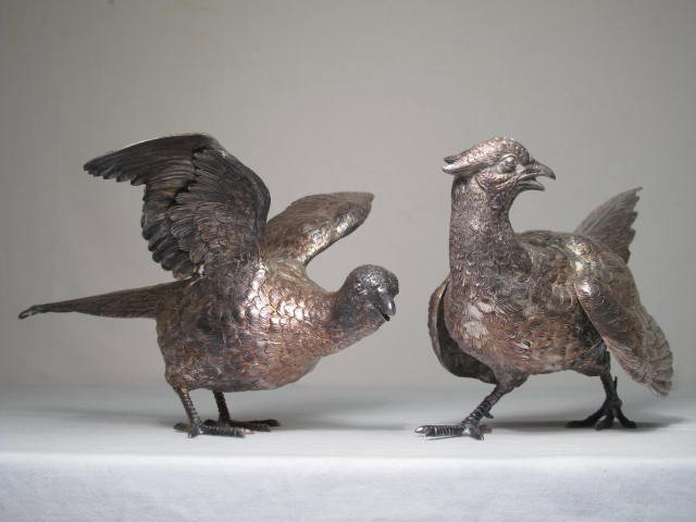 ENGLISH STERLING SILVER PHEASANT SCULPTURES: Pair of English sterling silver sculpture in the form of two Pheasant birds. Each hallmarked and stamped 925 on the tail feathers. Condition: Good, tarnished, see images. One measures 12" tail to head