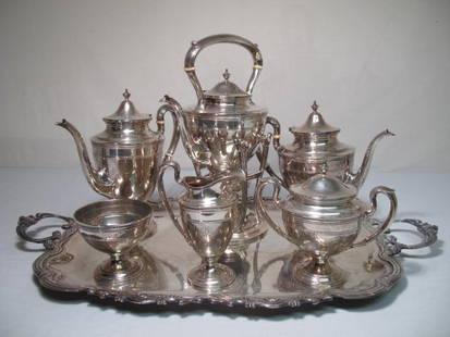 GORHAM STERLING SILVER TEA & COFFEE SERVICE: Gorham sterling silver tea & coffee service. Includes tray, tea maker and heater, coffeepot, teapot, waste bowl, sugar bowl, and creamer. All pieces monogrammed "GC" on sides. Marked on base " Gorham