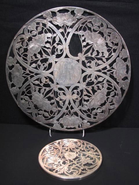 SILVER OVERLAY GLASS CAKE PLATE & TRIVET: Silver overlay glass cake plate & trivet. Cake plate marked on edge "M 786 999 1000". Trivet marked " Sterling A92B" on side. Condition: some small silver loss, silver has minor breaks at some joints