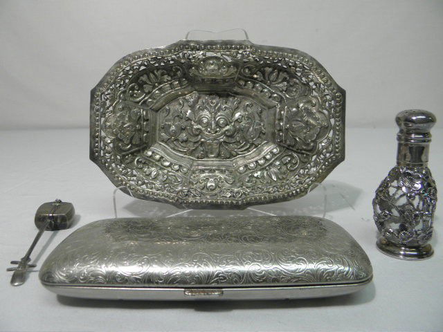 LOT ASSORTED SILVER & SILVER PLATE ITEMS 4PCS: Lot of assorted sterling silver & silver plate items. Includes a silver plate etched glasses case, small musical themed pill box, silver overlay shaker, and an embossed sterling silver tray/dish. Pill