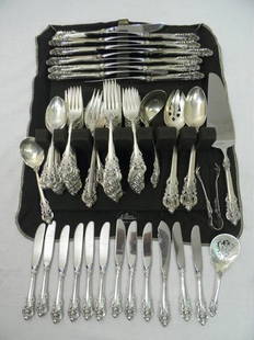 WALLACE STERLING SILVER GRAND BAROQUE FOR 12: Wallace sterling silver flatware service for 12 in the Grand Baroque pattern. Includes 12 of: teaspoons, dessert forks, salad forks, dinner forks, dinner knives, and butter knives. Also includes a lad