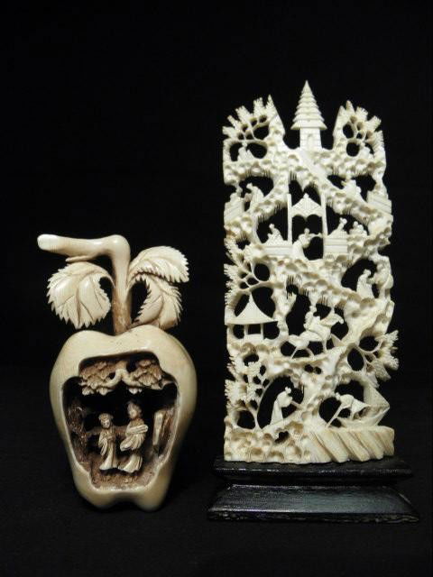 CHINESE CARVED IVORY APPLE & PAGODA: A Chinese carved ivory apple with interior carved scene, sold together with a carved ivory pagoda. Apple measures 4.5" tall x 2.25" wide. Pagoda scene is mounted on wooden base. Measures 7.25" tall x
