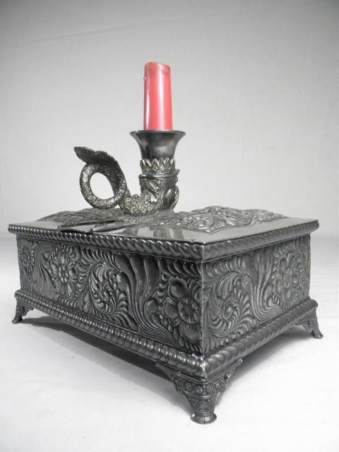 VICTORIAN SILVER PLATED FIGURAL HUMIDOR: Victorian silver plated figural humidor with candlestick. Figural dolphin candlestick with handle on top. Marked "Meriden B Company" on bottom. Both sides open, as well as middle. Monogrammed "S" on t